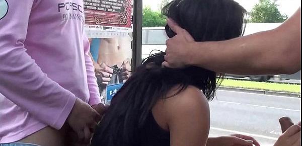  A gorgeous big breasted brunette in public street bus stop threesome orgy gang bang with 2 hung guys with big dicks fucking her with a blowjob and vaginal pussy sex action in front of all the car, bus, and truck drivers and people walking on the street